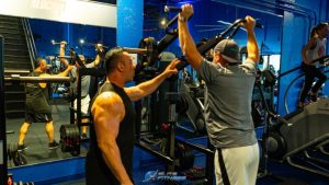 Personal Trainer Delray Beach teaching someone how to workout.